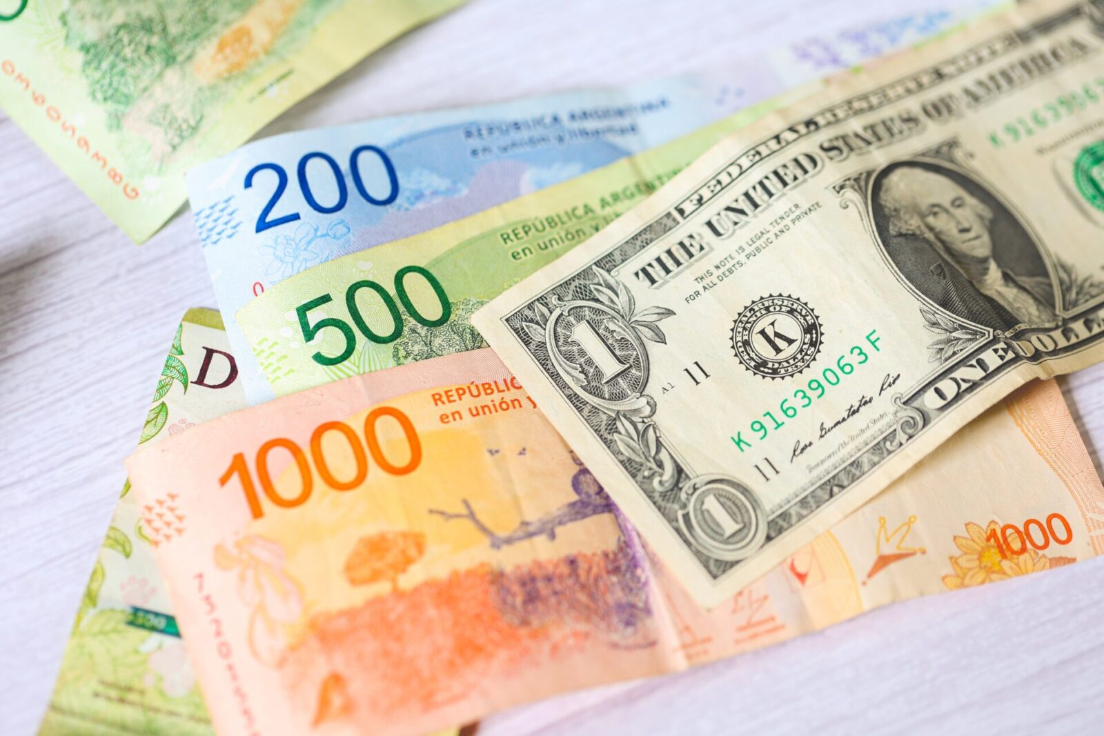 Argentine pesos nestle next to US dollars