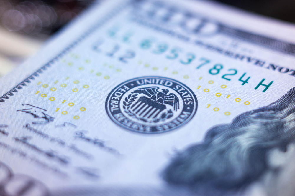 Fed cuts and warns of policy tensions